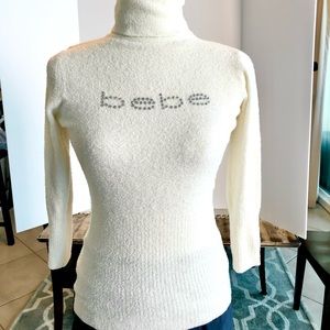 Bebe turtleneck sweater with glittering front logo